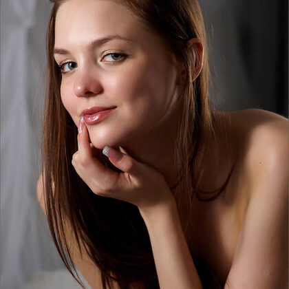 Amelie 002 11-amelie-undressing-slowly-in-navy-top-with-sensual-soft-glow.jpg