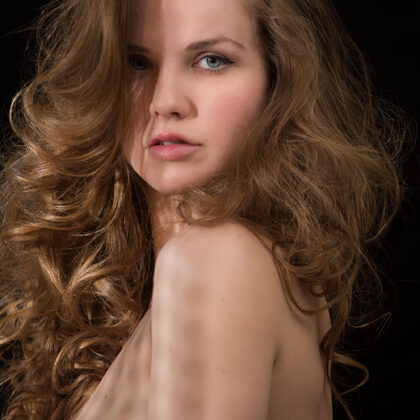 Camilla A 001 12-dark-studio-chair-poses-with-dramatic-light-by-camilla-a-indoors.jpg