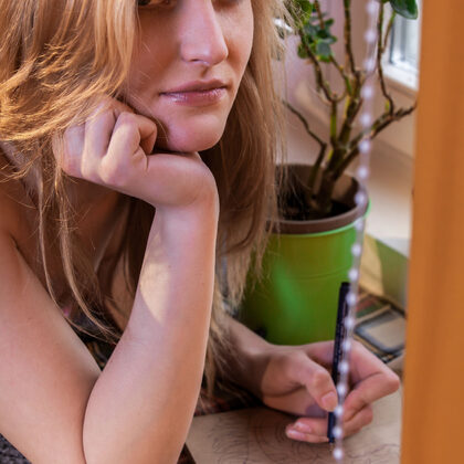 Eidis 001 12-eidis-reading-by-the-window-in-pink-sweater-and-socks.jpg