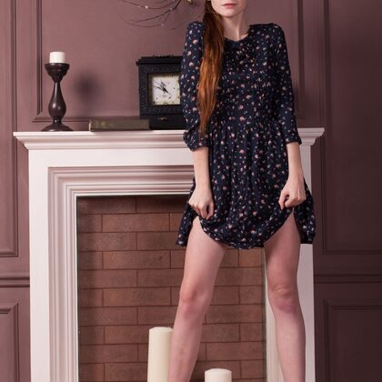 Emily Bloom 002 02-classic-fireplace-tease-with-emily-in-floral-dress-indoors-scene.jpg