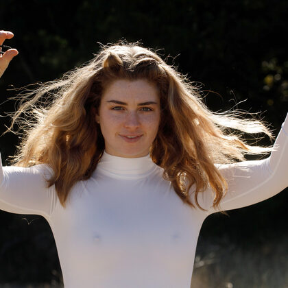 Greta Yarbrough 004 03-white-catsuit-adventure-with-greta-yarbrough-under-clear-blue-sky.jpg