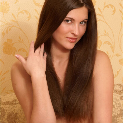 Jezebel 001 07-jezebel-posing-topless-on-beige-couch-in-soft-golden-light.jpg