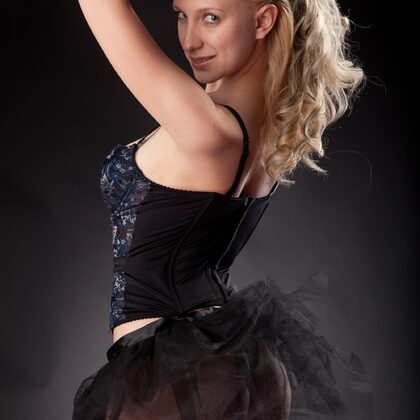 Katja B 002 01-katy-undressing-on-studio-set-in-black-corset-and-sheer-skirt.jpg