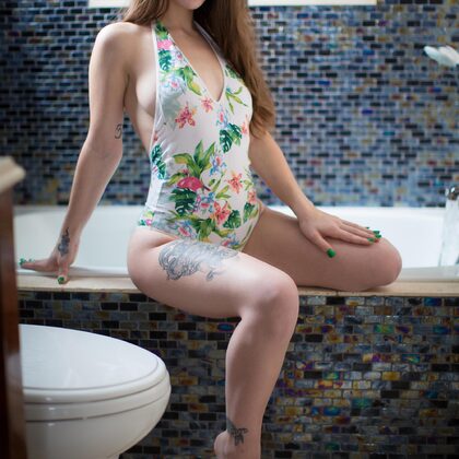 Lunaraise 001 01-floral-swimsuit-tease-in-bathroom-light-with-lunaraise-glow.jpg