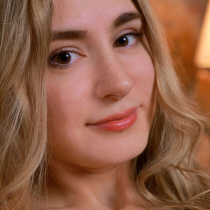 Maria Bern 002 10-warm-brick-wall-sofa-portrait-with-maria-bern-in-white-lace-bodysuit.jpg