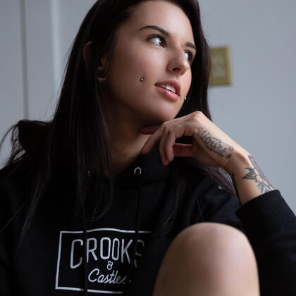 Octavia May 001 02-tattooed-brunette-octavia-may-in-black-hoodie-teasing-by-the-window.jpg