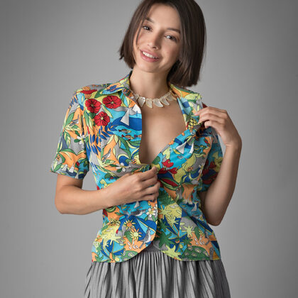 Olivia Linz 002 01-minimal-studio-tease-scene-with-olivia-linz-in-colorful-shirt-style.jpg