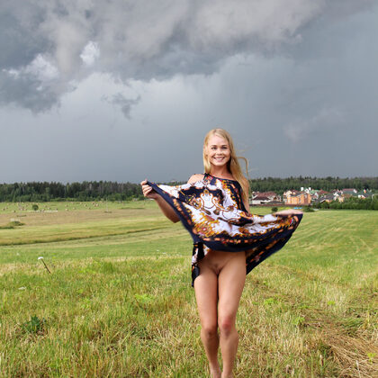 Sarika A 068 02-natural-meadow-portrait-with-darina-beneath-stormy-summer-skies.jpg