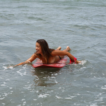 Yanira Prado 002 03-yanira-prado-pics-on-the-beach-with-surfboard-and-playful-charm.jpg